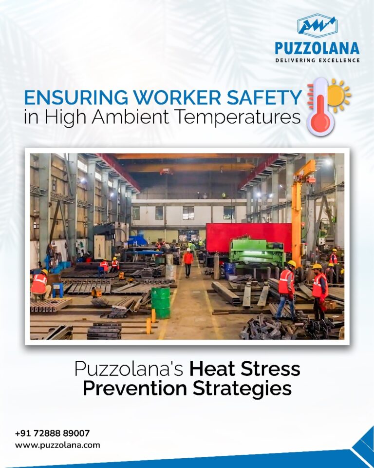 Workers in safety gear near Puzzolana crushing equipment with hydration and cooling stations at a high-temperature industrial site.